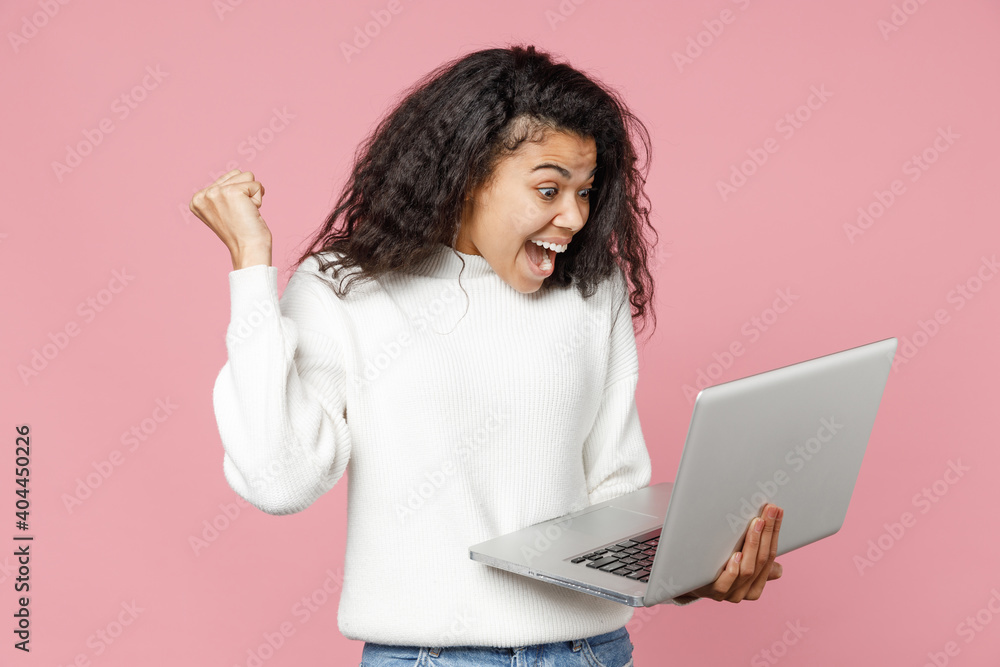 Φωτογραφία Young happy successful african american curly woman 20s in white knitted sweater