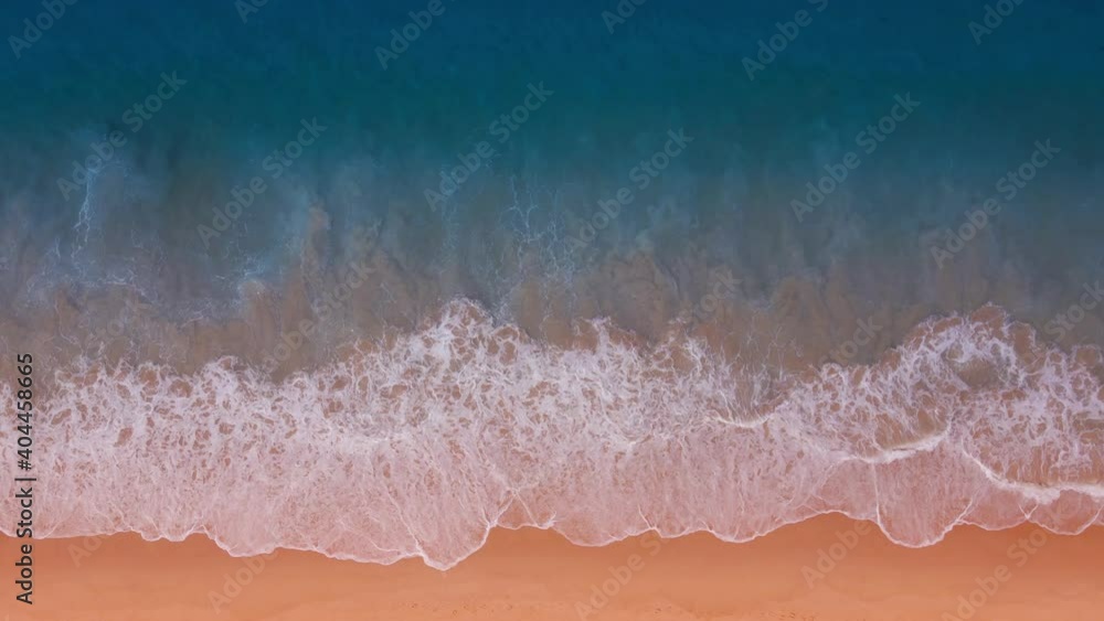 Aerial view of drone. Scene of top view beach and seawater on sandy beach in summer. Nature and travel concept. Aerial view of drone. Scene of top view beach and seawater on sandy beach in summer. Nature and travel concept.