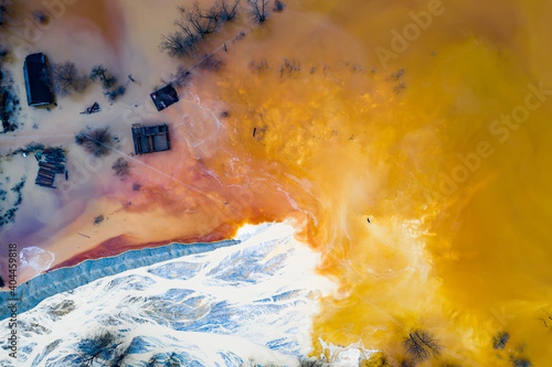 Drone view of contaminated, toxic water stream in Geamana, Romania - colorful abstract background. photo