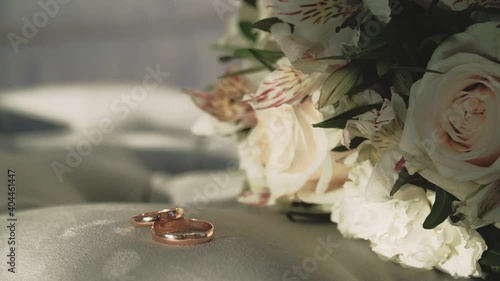 Beautiful bouquet of flowers and gold wedding rings