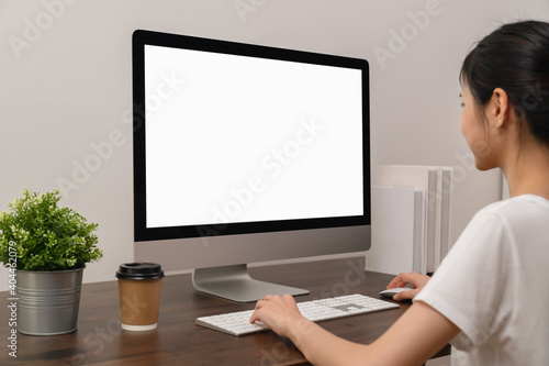 Business woman hand using computer and type on the keyboard. Mockup screen of advertisement.