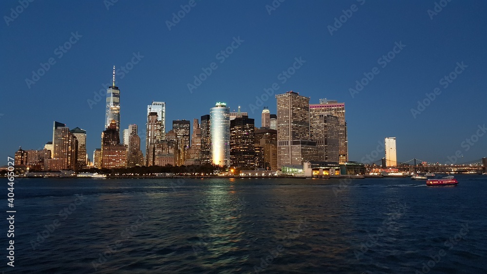 Manhattan financial district from Staten Island Ferry at dusk Manhattan financial district from Staten Island Ferry at dusk