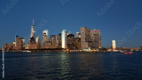 Manhattan financial district from Staten Island Ferry at dusk © Simon