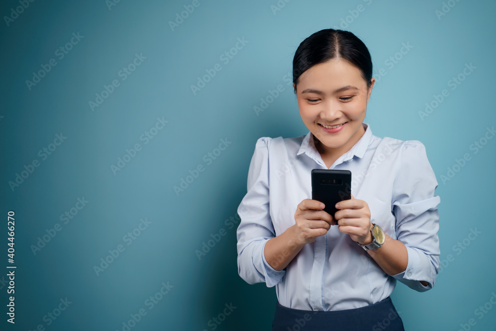 Asian woman happy use smart phone isolated on background. Asian woman happy use smart phone isolated on background.