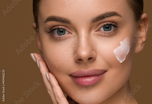 Cream face woman beauty healthy skin hand touching close up portrait