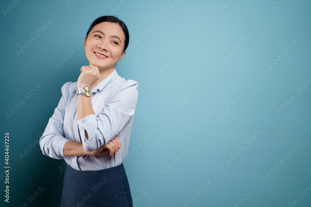 Asian woman happy surprised isolated on blue background. Asian woman happy surprised isolated on blue background.