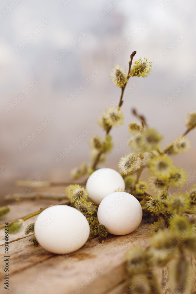 White chicken eggs on rustic wooden table White chicken eggs on rustic wooden table