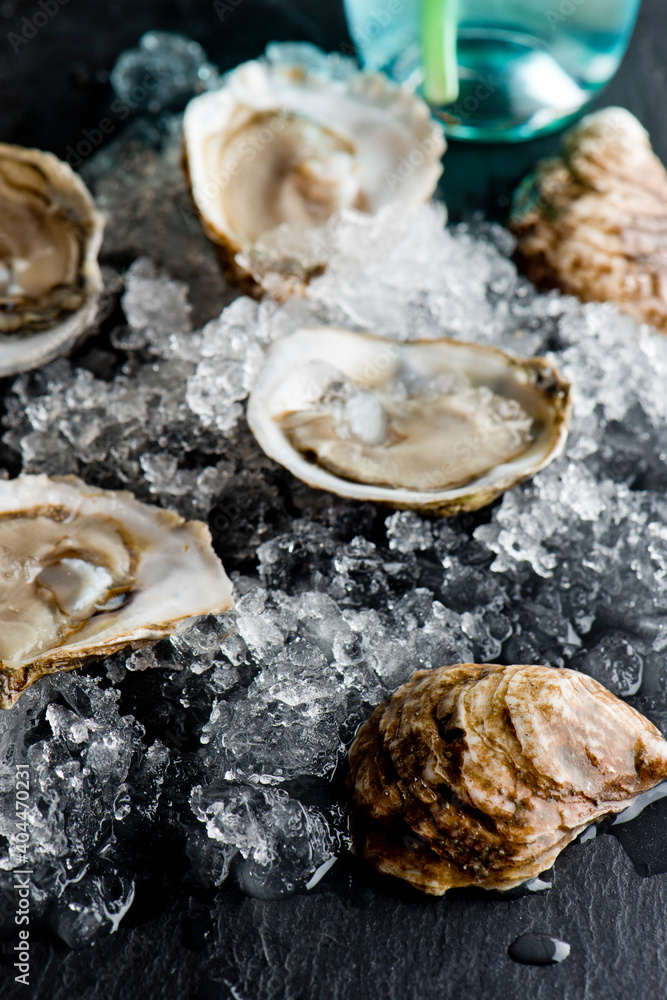 Oysters. Oysters on the half shell. Fresh oysters served with garlic, shallots, cocktail sauce, mignonette sauce and fresh lemons and limes. Classic American steakhouse or French bistro appetizer. Oysters. Oysters on the half shell. Fresh oysters served with garlic, shallots, cocktail sauce, mignonette sauce and fresh lemons and limes. Classic American steakhouse or French bistro appetizer.