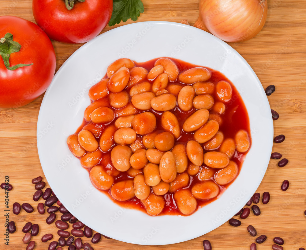 Beans stewed with tomato sauce on a dish, top view Beans stewed with tomato sauce on a dish, top view