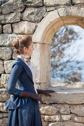 Romantic young beautiful lady outdoors. Victorian style vintage