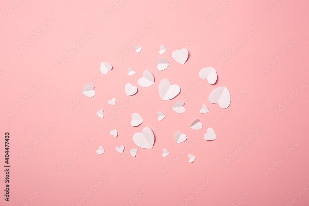 White paper hearts on a pink background. Composition of Valentine's Day. Banner. Flat lay, top view