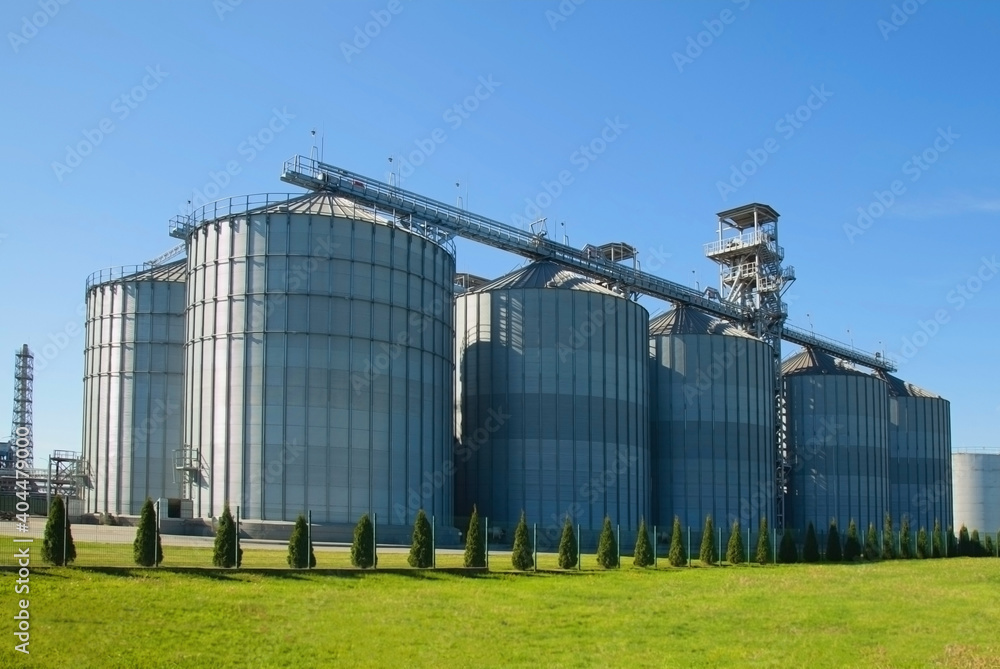 Granary. Modern agro-processing plant for the storage and processing of grain crops. Horizontal image.
