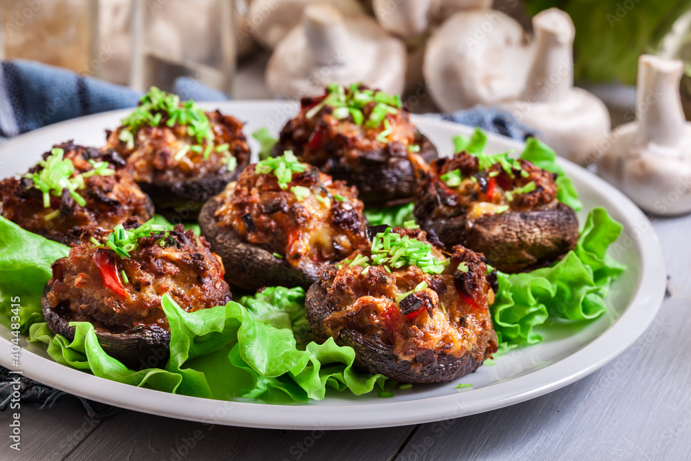 Baked champignon caps stuffed with minced meat