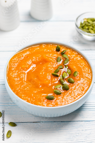 Creamy roasted pumpkin  soup  in a bowl. Space for text.