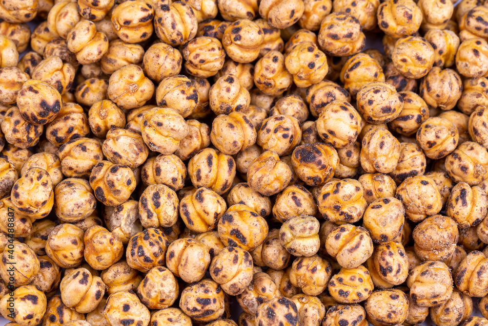 Roasted spicy chickpeas on white background Roasted spicy chickpeas on white background