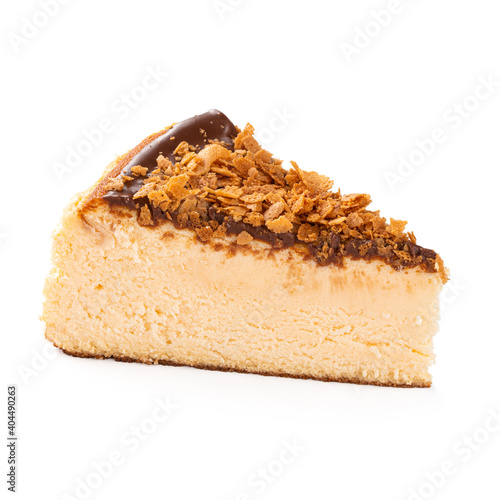 Isolated slice of spanish cheesecake with melted chocolate on the white background