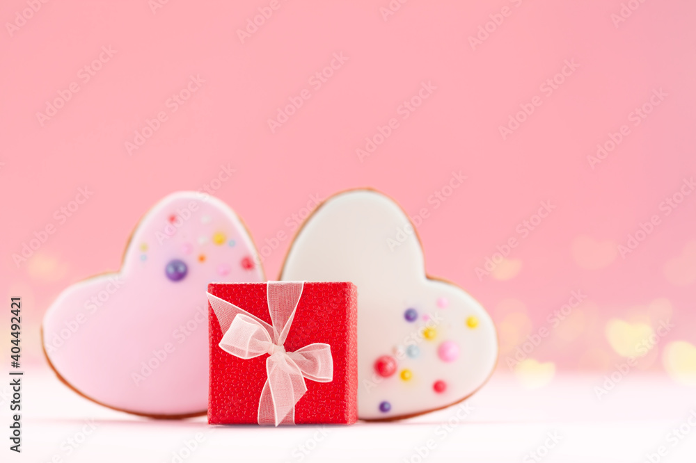 Red gift box with two hearts shaped gingerbread for Valentines Day, Mother Day or Birthday.
