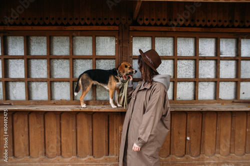 young stylish woman with an estonian hound dog