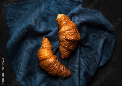  freshn croissants on a blue napkin photo