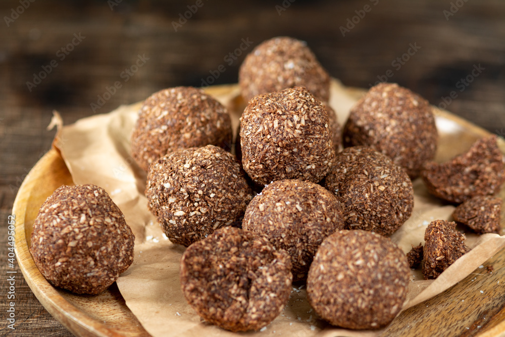 Chocolate coconuts. Chocolate balls with coconut. Chocolate candies or cookies with coconut, cinnamon and powdered sugar Chocolate coconuts. Chocolate balls with coconut. Chocolate candies or cookies with coconut, cinnamon and powdered sugar