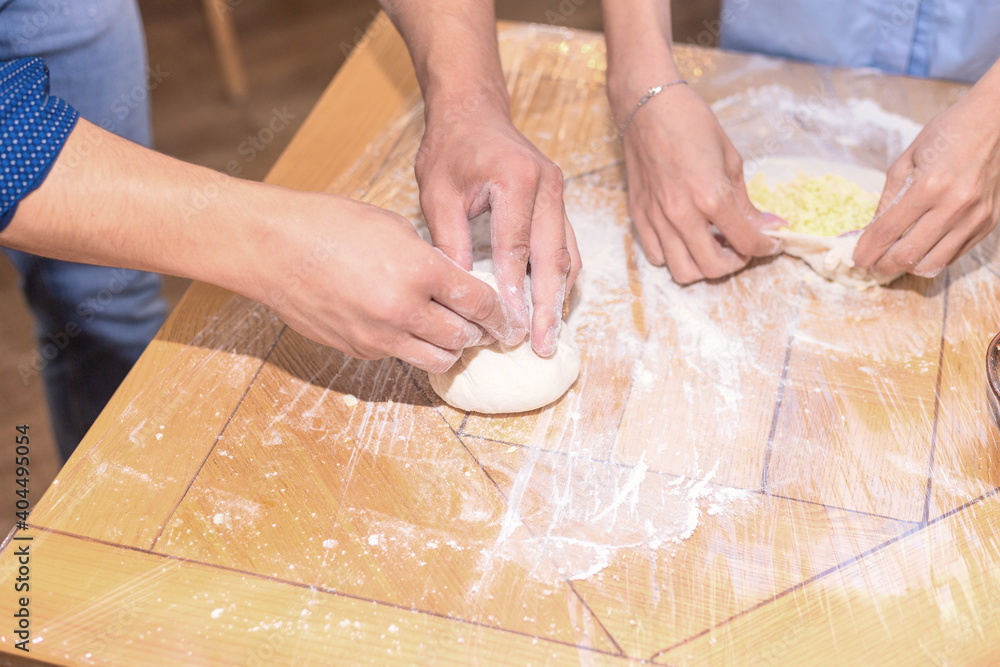 person rolling dough person rolling dough