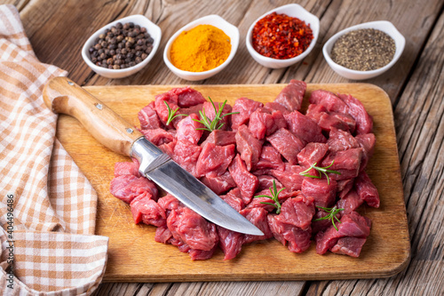 Heap of raw chopped beef isolated on cutting board