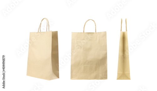 Brown folded paper bag with handles isolated on white background