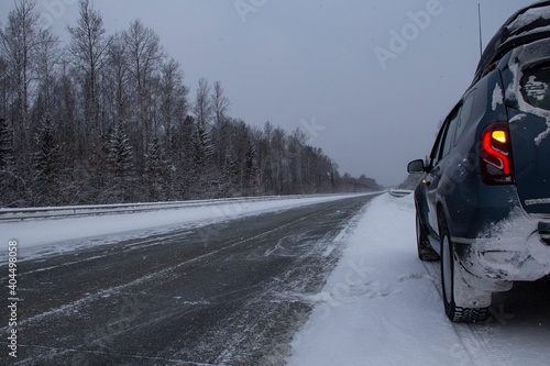 The road through snow and frost. A deserted track in the North in severe frost is a test for a car and a person.