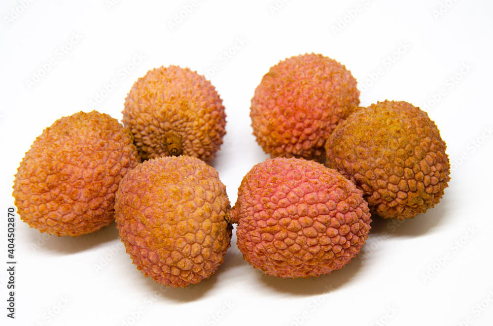 A close up view of a pile of lychees, a tropical fruit from Asia. A close up view of a pile of lychees, a tropical fruit from Asia.