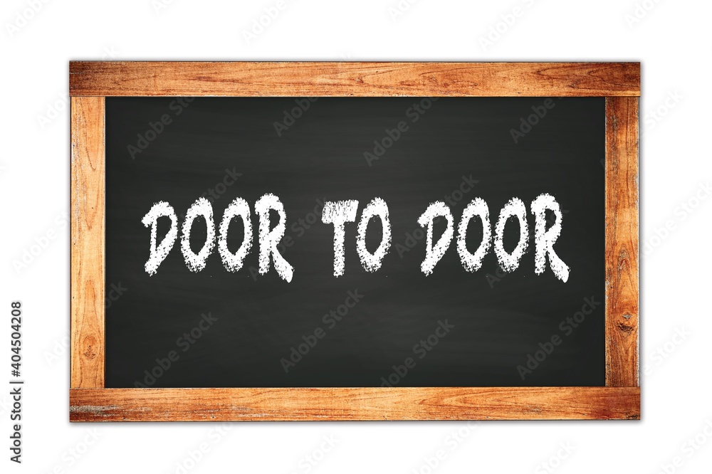 Obraz premium DOOR TO DOOR text written on wooden frame school blackboard.