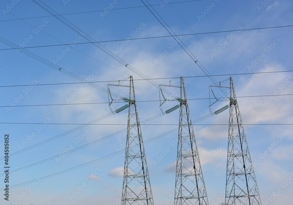 three power transmission towers against the blue sky, wires intersect, industrial graphics three power transmission towers against the blue sky, wires intersect, industrial graphics