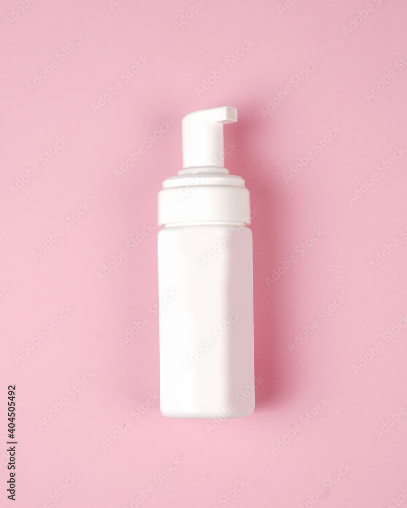 Soap bottles with pump mockup isolated on pink background. Cosmetic plastic bottle with different caps (spray, dispenser pump). Liquid container for gel, lotion, cream, shampoo, bath foam.