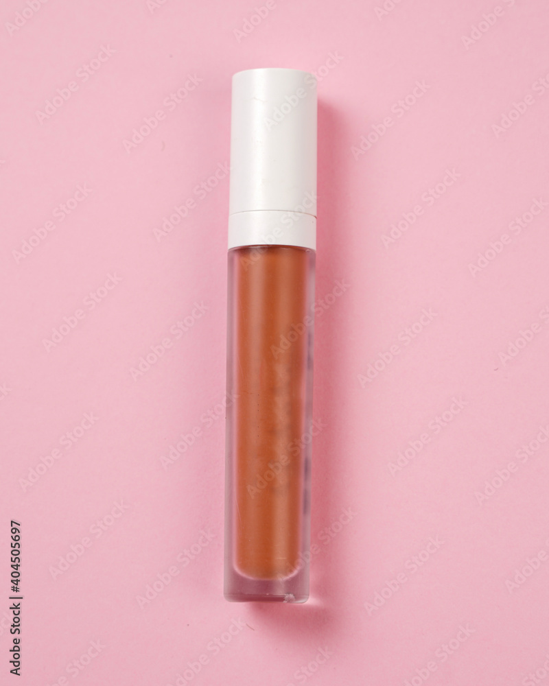 Liquid lipstick, Lip gloss in elegant glass bottle with white lid. Trendy colors of the season. Texture of lip gloss isolated on white background. Mock-up of packages for decorative cosmetic product. Liquid lipstick, Lip gloss in elegant glass bottle with white lid. Trendy colors of the season. Texture of lip gloss isolated on white background. Mock-up of packages for decorative cosmetic product.