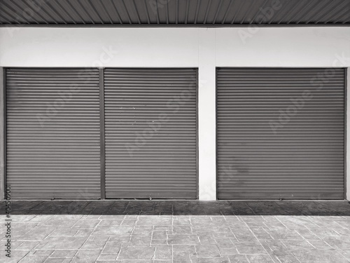 Steel shutter door of warehouse  storage or storefront for metal door background and textured.