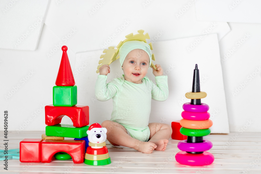 baby playing with toys in the children's room at home, the concept of development and leisure of toddlers baby playing with toys in the children's room at home, the concept of development and leisure of toddlers