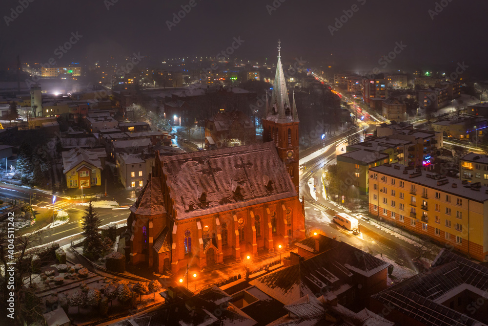 Aerial view of the old town square in Koscierzyna city by night, Poland