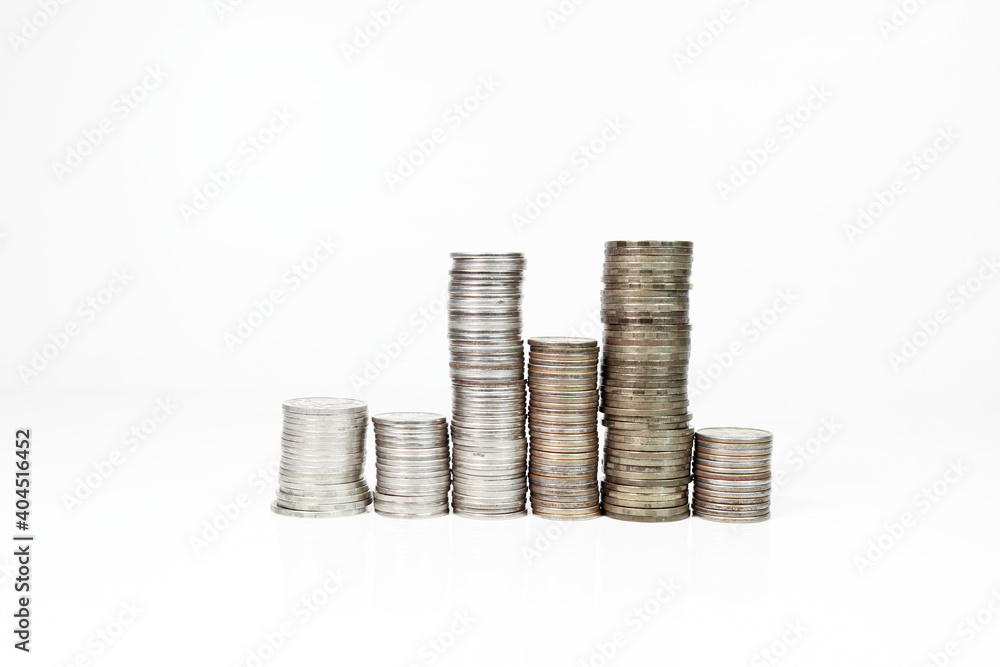 Columns of coins on a light background. Metallic currency. Money. Columns of coins on a light background. Metallic currency. Money.