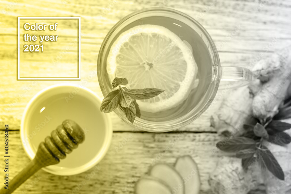 Ginger tea with lemon mint and honey on a white wooden background. Hot healthy winter drink. Color of the year 2021 Ginger tea with lemon mint and honey on a white wooden background. Hot healthy winter drink. Color of the year 2021