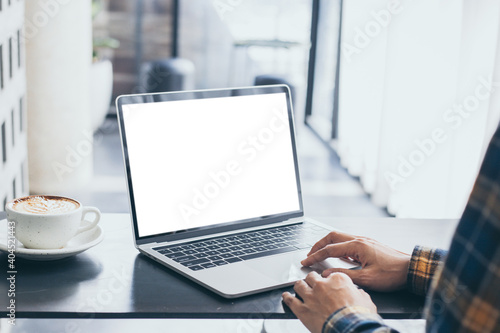 computer screen blank mockup.hand woman work using laptop with white background for advertising,contact business search information on desk at coffee shop.marketing and creative design