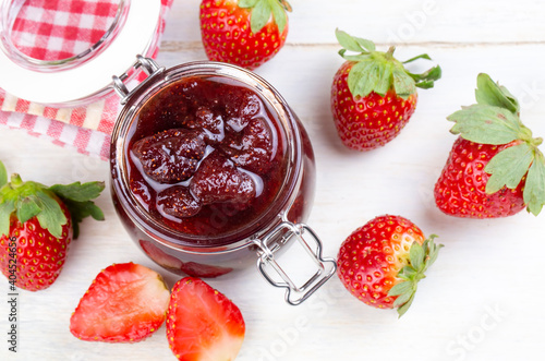 Bowl of strawberry jam isol...