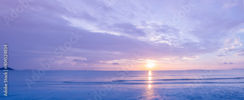 Beautiful panoramic tropical purple blue sea  sunset and yellow clouds background