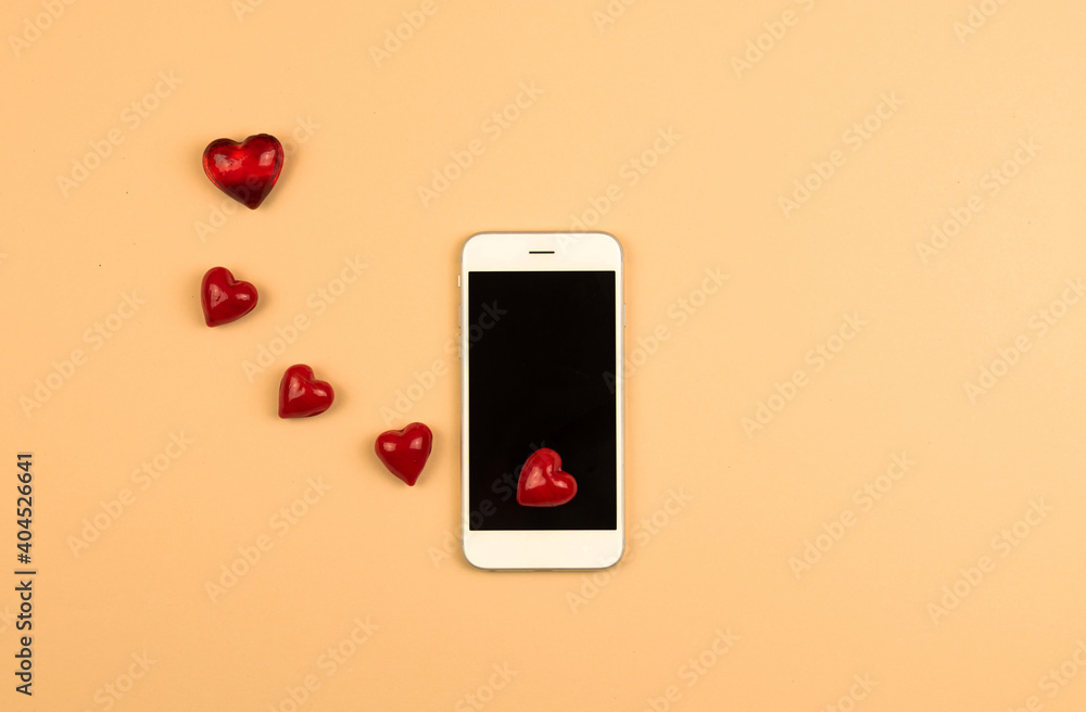 Modern Valentine's day concept, heart from smartphone, new messages, followers, background with copy space Modern Valentine's day concept, heart from smartphone, new messages, followers, background with copy space