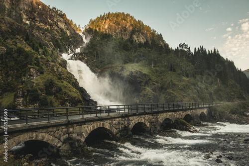 Bridge over the river in mountains, The Latefossen waterfall, Norway.