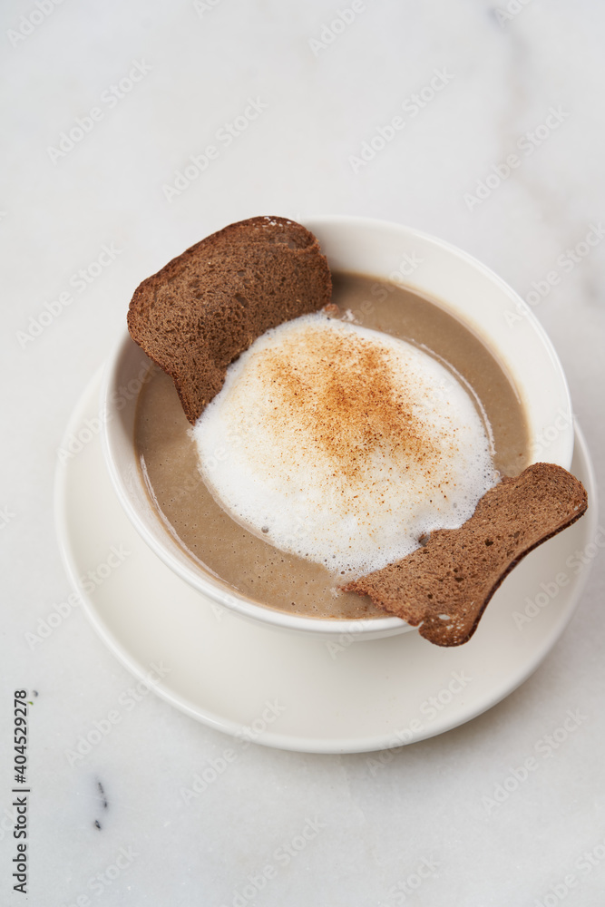 Mushroom soup with sour cream and Rye bread. Creamy mushroom soup Mushroom soup with sour cream and Rye bread. Creamy mushroom soup
