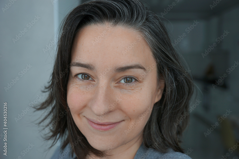 Portrait of a woman 40 years old without makeup with gray hair Portrait of a woman 40 years old without makeup with gray hair