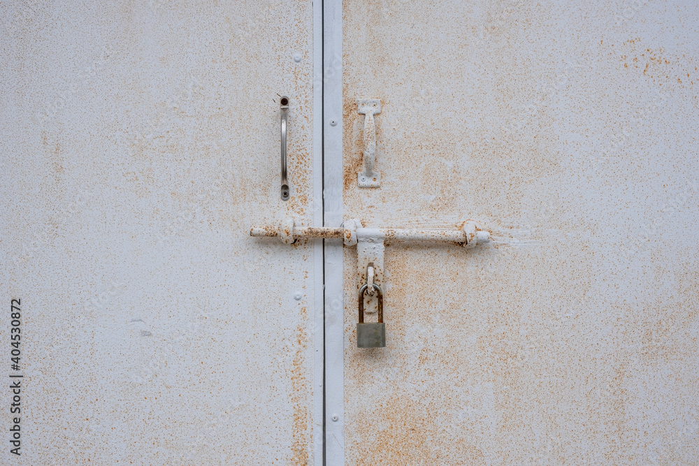 Weathered old wooden door with lock and padlock. Stock Photo. Weathered old wooden door with lock and padlock. Stock Photo.