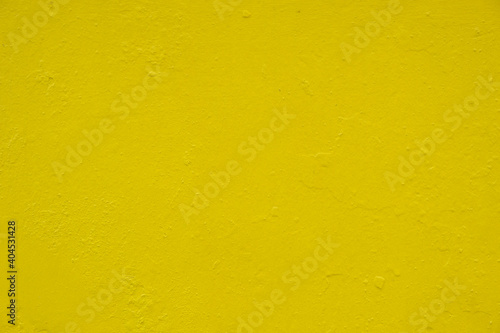 Yellow painted aged, grunge wall texture, background. Stock Photo.