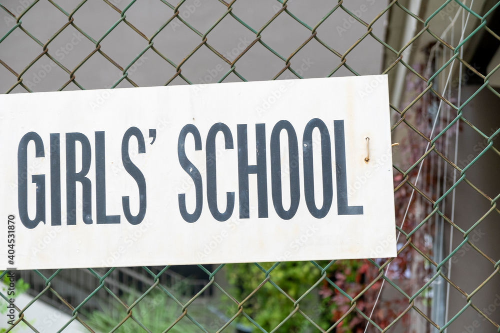 Girls School sign on fence. Stock Photo. Girls School sign on fence. Stock Photo.