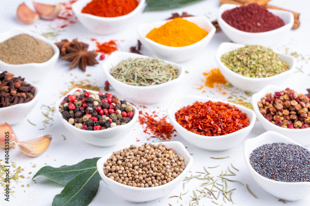 Assorted various spices on white background Assorted various spices on white background