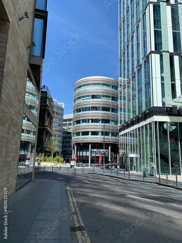 Modern buildings in Manchester City centre. Clear blue sky background. 